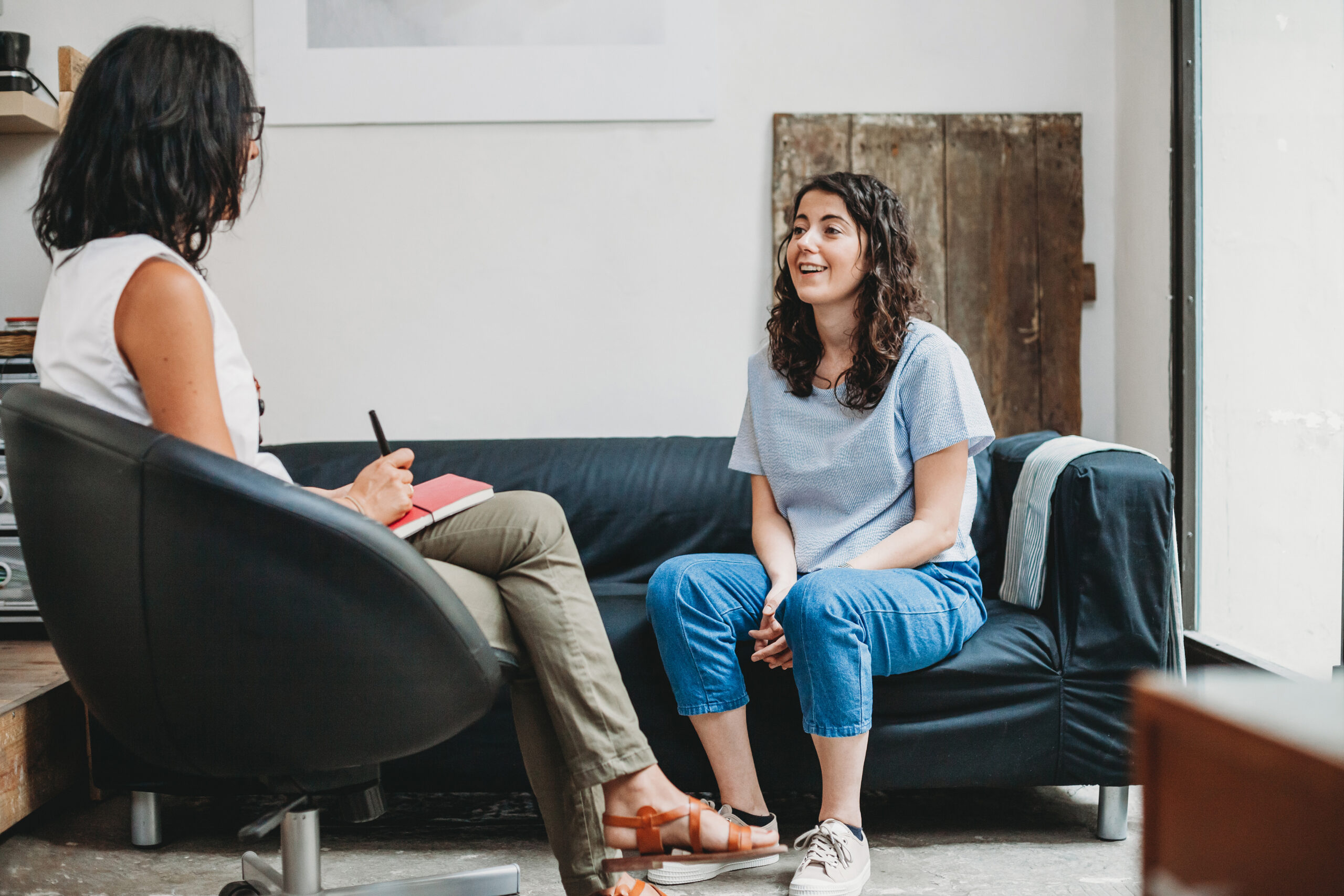 Women sitting with therapist having a EMDR session