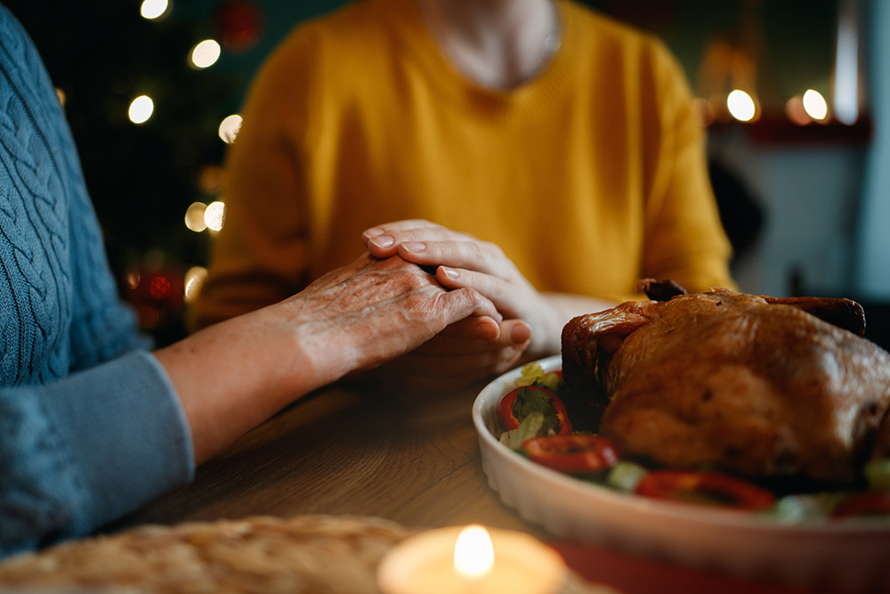 Family member showing support to a loved one who has holiday food anxiety and stress.