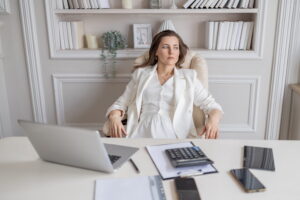 Professional woman at desk representing support for executive dysfunction in ADHD