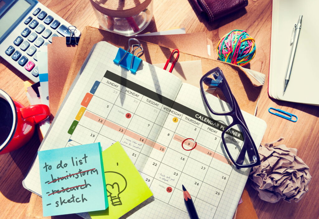 Planner and sticky notes representing executive dysfunction coping strategies for ADHD