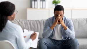 Why men struggle to seek therapy and open up in counseling.
